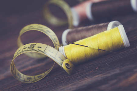 Sewing instruments, threads, needles, bobbins and materials. Studio photoの写真素材