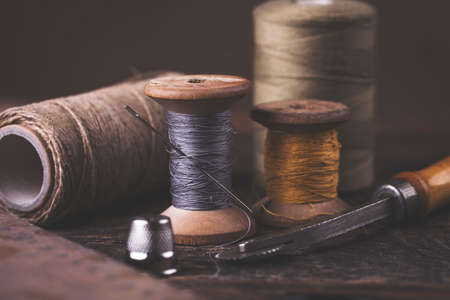 Sewing instruments, threads, needles, bobbins and materials. Studio photoの写真素材