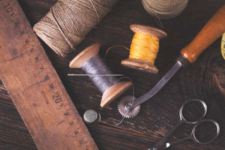 Sewing instruments, threads, needles, bobbins and materials. Studio photoの写真素材