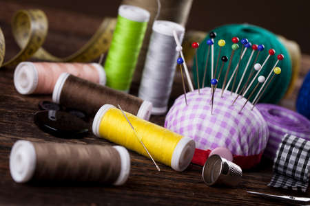 Sewing instruments, threads, needles, bobbins and materials. Studio photoの写真素材