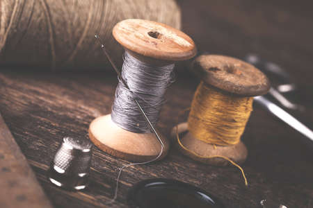 Sewing instruments, threads, needles, bobbins and materials. Studio photoの写真素材