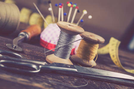 Sewing instruments, threads, needles, bobbins and materials. Studio photoの写真素材