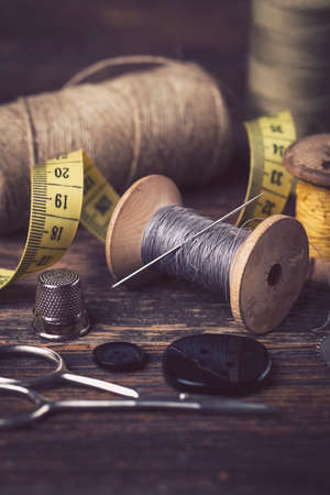 Sewing instruments, threads, needles, bobbins and materials. Studio photoの写真素材
