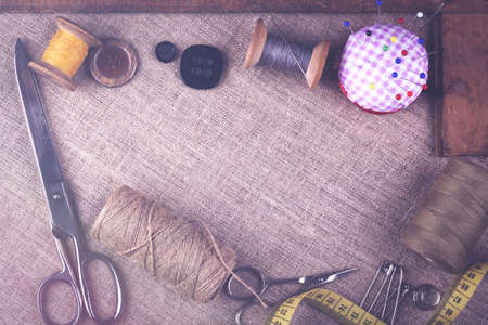 Sewing instruments, threads, needles, bobbins and materials. Studio photoの写真素材