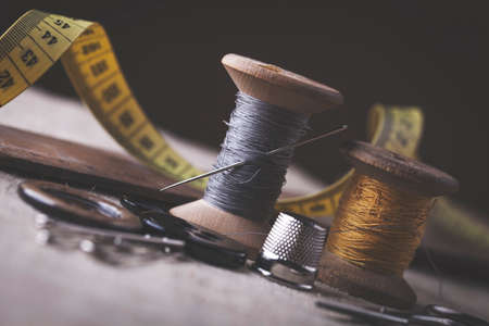 Sewing instruments, threads, needles, bobbins and materials. Studio photoの写真素材