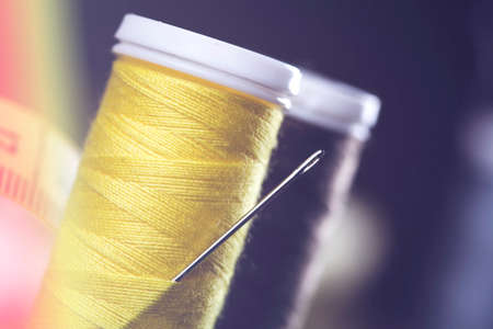 Sewing instruments, threads, needles, bobbins and materials. Studio photoの写真素材