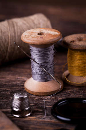 Sewing instruments, threads, needles, bobbins and materials. Studio photoの写真素材