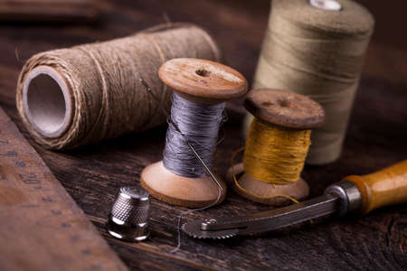 Sewing instruments, threads, needles, bobbins and materials. Studio photoの写真素材