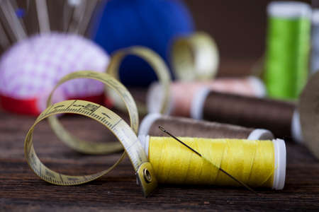 Sewing instruments, threads, needles, bobbins and materials. Studio photoの写真素材