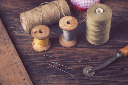 Sewing instruments, threads, needles, bobbins and materials. Studio photoの写真素材