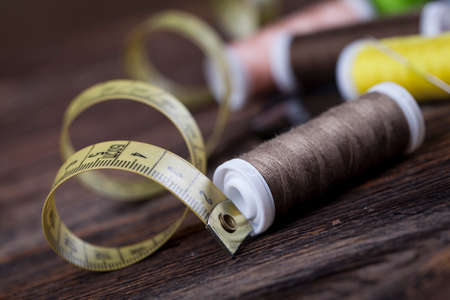 Sewing instruments, threads, needles, bobbins and materials. Studio photoの写真素材