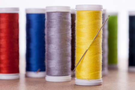 Sewing instruments, threads, needles, bobbins and materials. Studio photoの写真素材