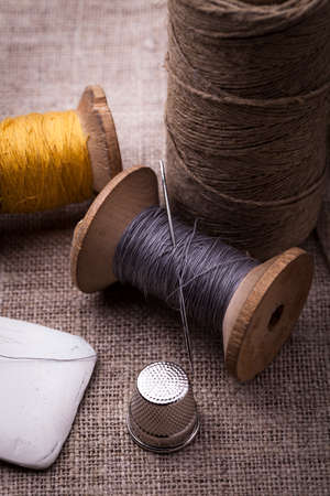 Sewing instruments, threads, needles, bobbins and materials. Studio photoの写真素材