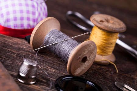 Sewing instruments, threads, needles, bobbins and materials. Studio photoの写真素材