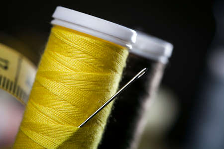 Sewing instruments, threads, needles, bobbins and materials. Studio photoの写真素材