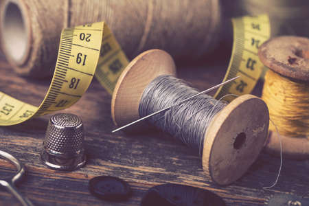 Sewing instruments, threads, needles, bobbins and materials. Studio photoの写真素材