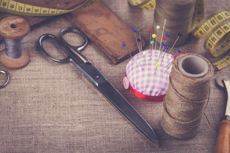 Sewing instruments, threads, needles, bobbins and materials. Studio photoの写真素材