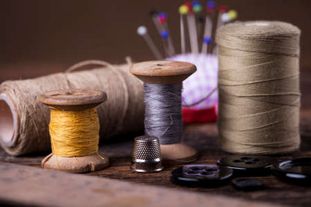 Sewing instruments, threads, needles, bobbins and materials. Studio photoの写真素材