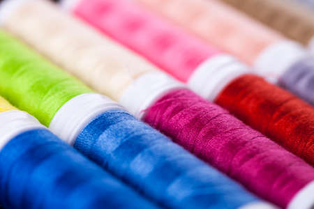 Sewing instruments, threads, needles, bobbins and materials. Studio photoの写真素材