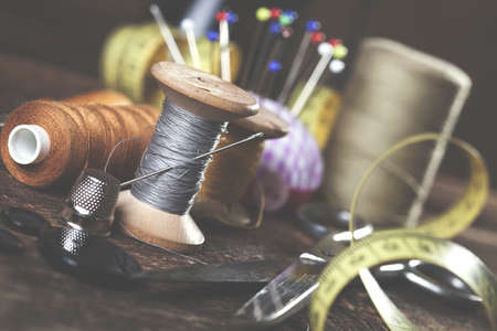 Sewing instruments, threads, needles, bobbins and materials. Studio photoの写真素材