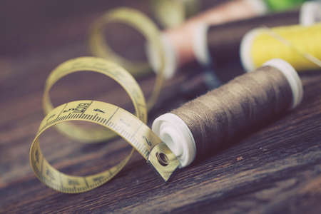 Sewing instruments, threads, needles, bobbins and materials. Studio photoの写真素材