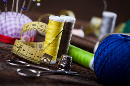 Sewing instruments, threads, needles, bobbins and materials. Studio photoの写真素材