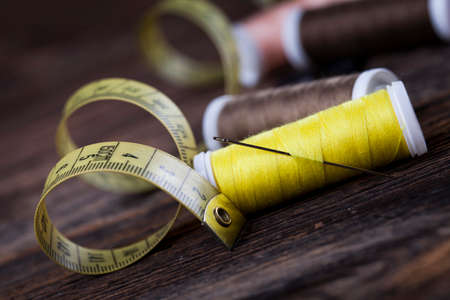Sewing instruments, threads, needles, bobbins and materials. Studio photoの写真素材