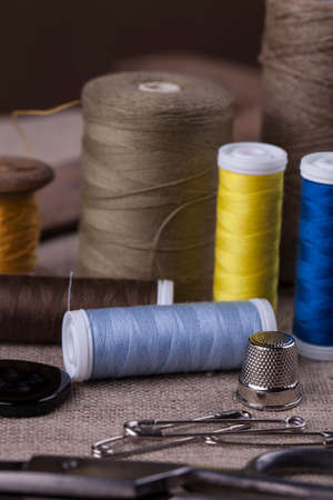 Sewing instruments, threads, needles, bobbins and materials. Studio photoの写真素材