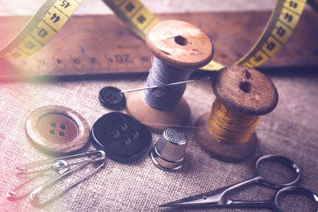 Sewing instruments, threads, needles, bobbins and materials. Studio photoの写真素材