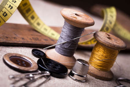 Sewing instruments, threads, needles, bobbins and materials. Studio photoの写真素材