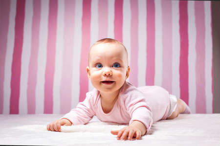 Young girl. Beautiful infant portrait on colorful background.の写真素材