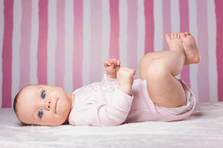 Young girl. Beautiful infant portrait on colorful background.の写真素材