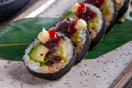 Sushi roll with tuna, avocado, red caviar and wasabiの写真素材