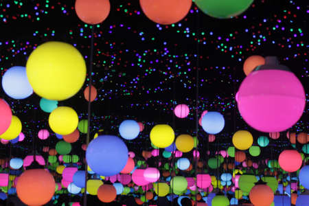Colorful paper lanterns in the night sky. Lighting decoration.の写真素材