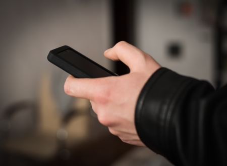 Close up of a man using mobile smart phone