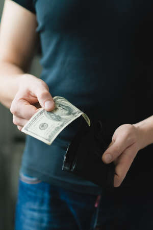 Man gets $ 100 from her purseの写真素材