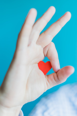 Small paper heart in armの写真素材