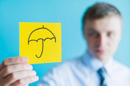 Hand with umbrella  iconの写真素材