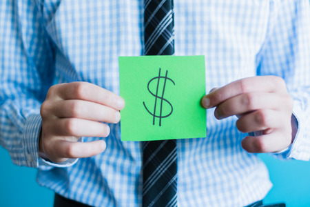 Businessman holding dollar signの写真素材