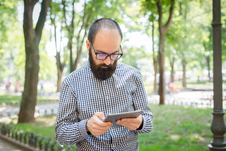 businessman using touch pad of tablet pcの写真素材