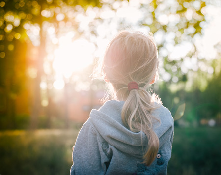 little girl and sunsetの写真素材