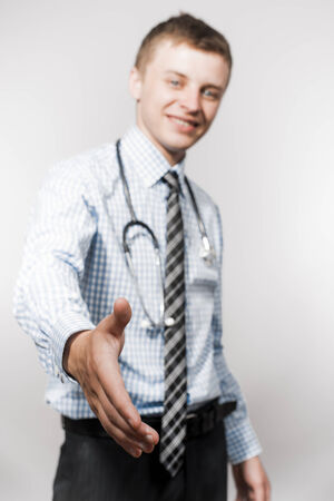 Close up of doctor giving her hand for handshakeの写真素材