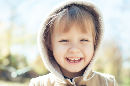 laughing face of baby girlの写真素材