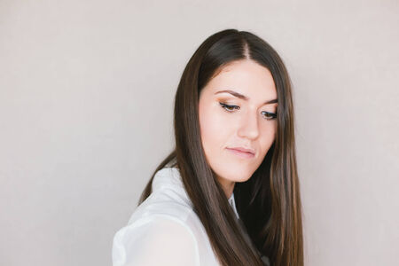 close-up portrait of a young brunette girlの写真素材