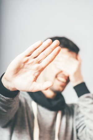 man does not want to be photographedの写真素材