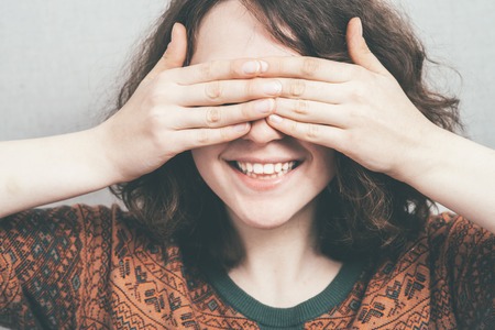 woman covering her eyesの写真素材