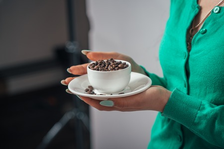 Woman hand with white cup.の写真素材