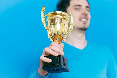 man with a golden cup