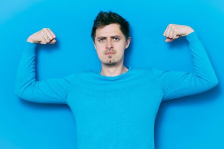 man showing her muscles
