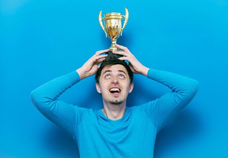 man with a golden cupの写真素材